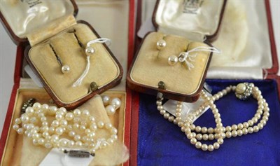 Lot 38 - A cultured pearl necklace, a simulated pearl necklace and two pairs of simulated pearl earrings