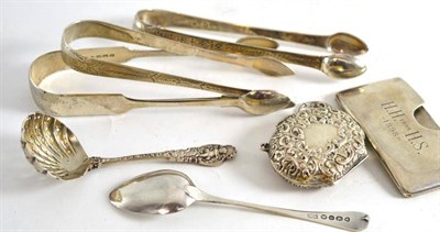 Lot 39 - A Victorian silver sifter spoon, London 1894, three pairs of sugar tongs, a silver purse, a...