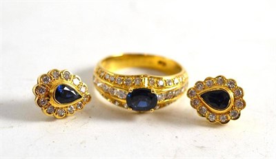 Lot 43 - A sapphire and diamond ring, stamped '750' and a pair of pear shaped sapphire and diamond...