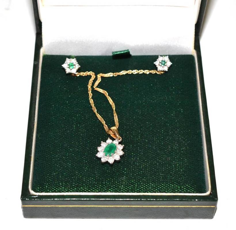 Lot 44 - An emerald pendant and earrings