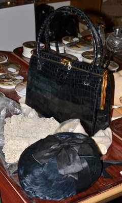 Lot 78 - Asprey black leather wallet, black leather handbag, feather and net hat and a lace collar