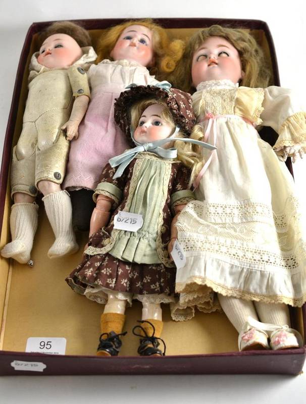 Lot 95 - Four assorted bisque socket head dolls (a.f.), one on a jointed kid leather body, some clothed
