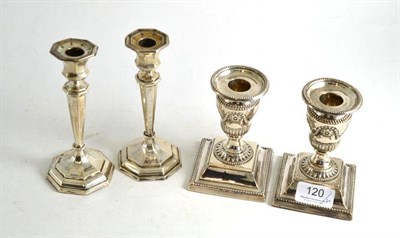 Lot 120 - Two pairs of silver candlesticks, Sheffield, Chester hallmarks