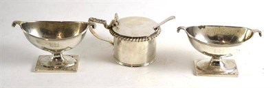 Lot 122 - Two similar George III oval salts and a silver mustard