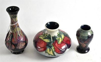 Lot 130 - A modern Moorcroft vase, decorated with plums, dated circa 96, 10.5cm; a Moorcroft Finches...
