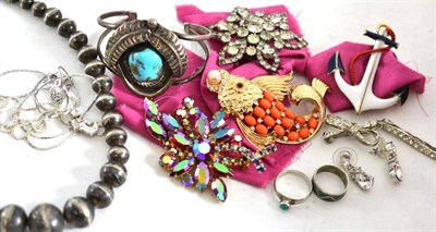 Lot 144 - A Navaho silver necklace, brooch, ring, a Mexican ring and a quantity of costume jewellery...