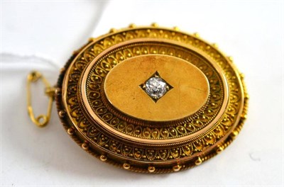 Lot 145 - Victorian oval brooch with old cut diamond centrally, and locket back, estimated diamond weight...