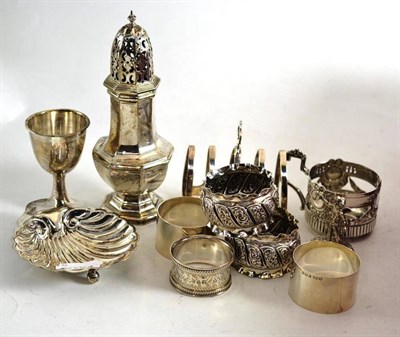 Lot 165 - Small group of silver including sugar caster, shell butter dish, napkin rings etc