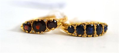 Lot 170 - An 18ct gold garnet and diamond ring and an 18ct gold sapphire and diamond ring