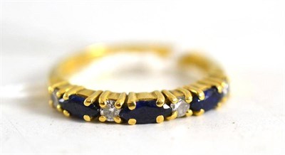 Lot 188 - An 18ct gold sapphire and diamond half eternity ring