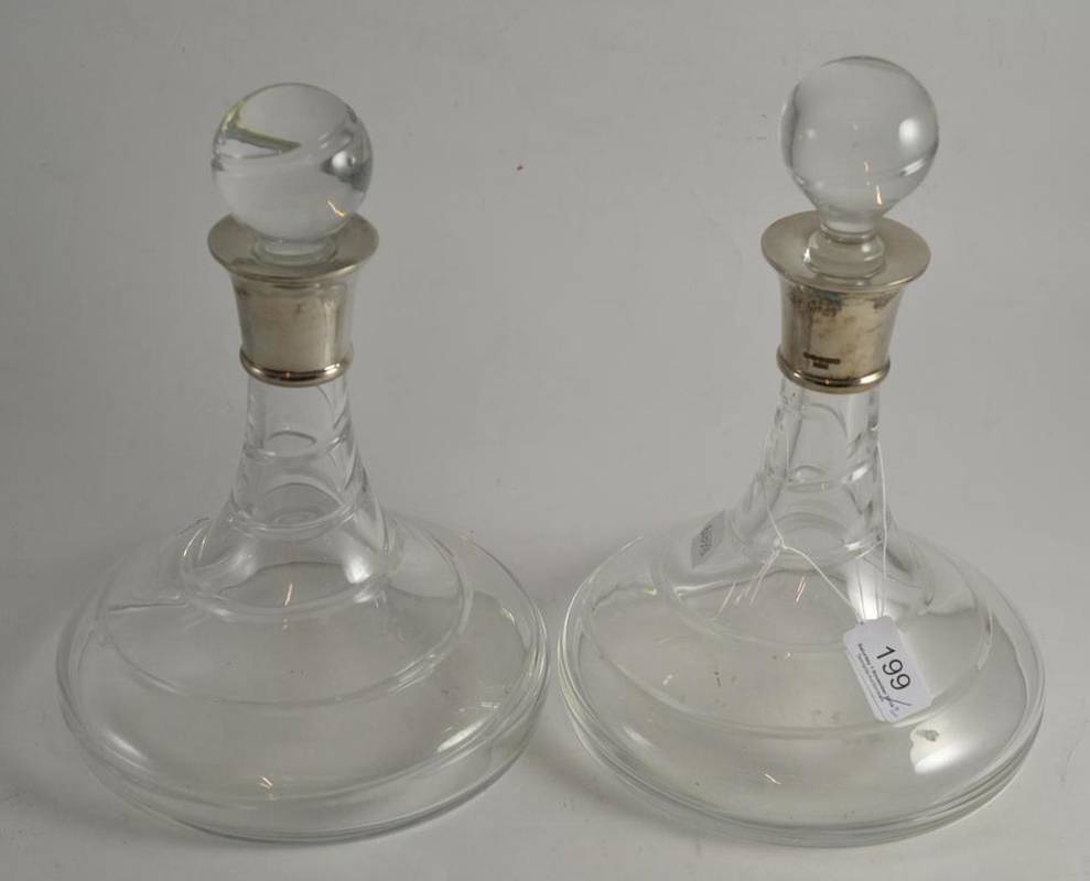 Lot 199 - A pair of silver mounted ship's decanters