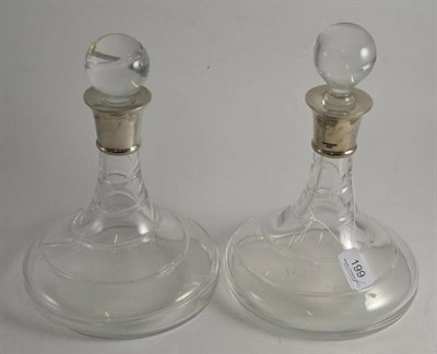 Lot 199 - A pair of silver mounted ship's decanters