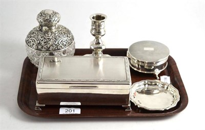 Lot 201 - A silver cigarette case, a silver circular jewel box, a silver candlestick, a small shaped dish and