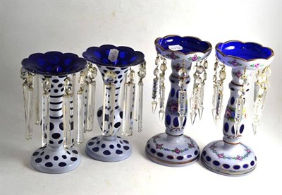 Lot 203 - Two pairs of white overlay glass lustres with drops