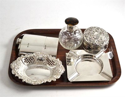 Lot 204 - A silver hip flask, a silver ashtray, pierced oval dish, a tortoiseshell mounted scent and embossed