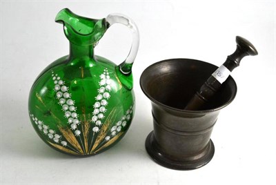 Lot 206 - A bronze pestle and mortar and Victorian green glass jug painted with Lily of the Valley (2)