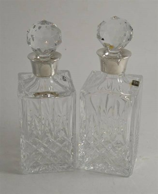 Lot 207 - A pair of silver mounted decanters