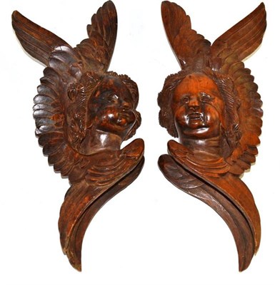 Lot 232 - A pair of 18th/19th century carved limewood cherubic corbels