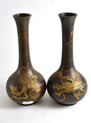 Lot 264 - Pair of Japanese bronze and gold lacquer bottle vases decorated with dragons