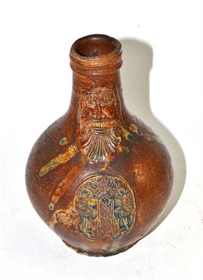 Lot 267 - A 17th century stoneware bellamine decorated with a coat of arms