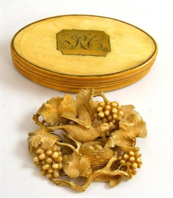 Lot 3 - A Georgian horn oval snuff box engraved RC and a 19th century carved ivory brooch in the form...