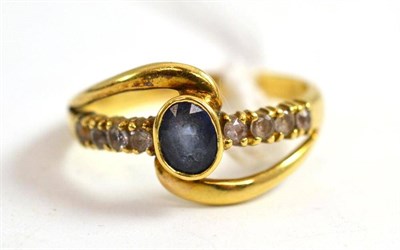 Lot 23 - A sapphire and diamond dress ring
