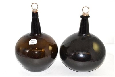 Lot 50 - Two amber tinted glass globular flasks with silver corkscrews