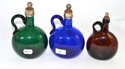 Lot 57 - Three coloured glass decanters
