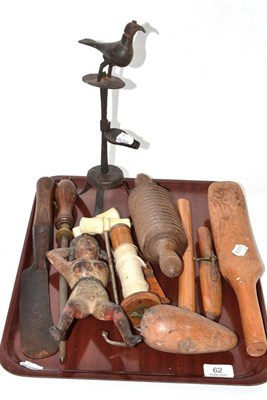 Lot 62 - A tray of collectables including a boot jack, a pair of boot pulls, a wrought iron Cruz lamp, slide