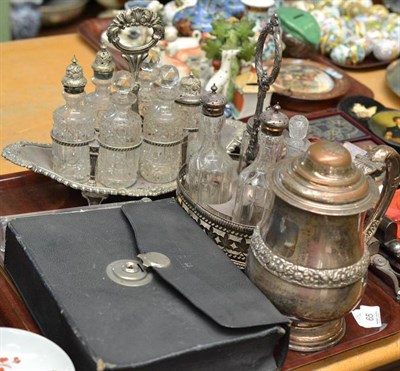 Lot 65 - Two silver plated cruet sets and a Victorian toilet set in a leather fitted case