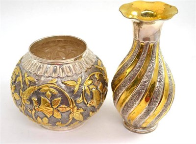 Lot 76 - White metal and parcel gilt vase and a globular vase decorated with foliage, both stamped 900 (2)