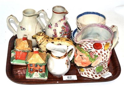 Lot 82 - A tray including two sparrow beak jugs, two flower encrusted tea bowls and saucers decorated...