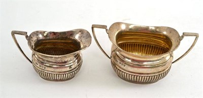 Lot 108 - A silver milk jug and sugar bowl, London 1893