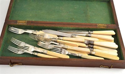 Lot 120 - A set of twelve fish knives and forks with ivory handles and silver blades and tines, Walker &...