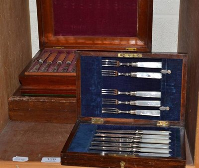 Lot 139 - A cased set of twelve ivory and silver plated fish knives and forks, a set of six cake knives...