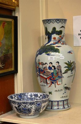 Lot 144 - A copy of a large Chinese vase painted with figures and a blue and white bowl (2)