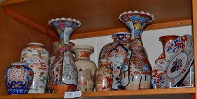 Lot 150 - A shelf of Japanese ceramics including an Imari large vase, Satsuma vases, plates etc