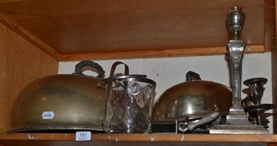 Lot 151 - A shelf of silver plated ware including two meat dish covers, a candelabrum, a pair of...