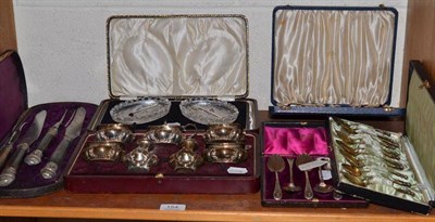 Lot 154 - A collection of cased flatware comprising twelve maiden-head coffee spoons in a fitted presentation