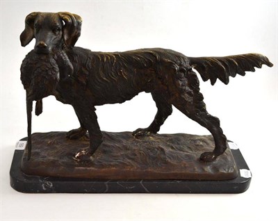 Lot 169 - Reproduction cast metal dog holding a pheasant