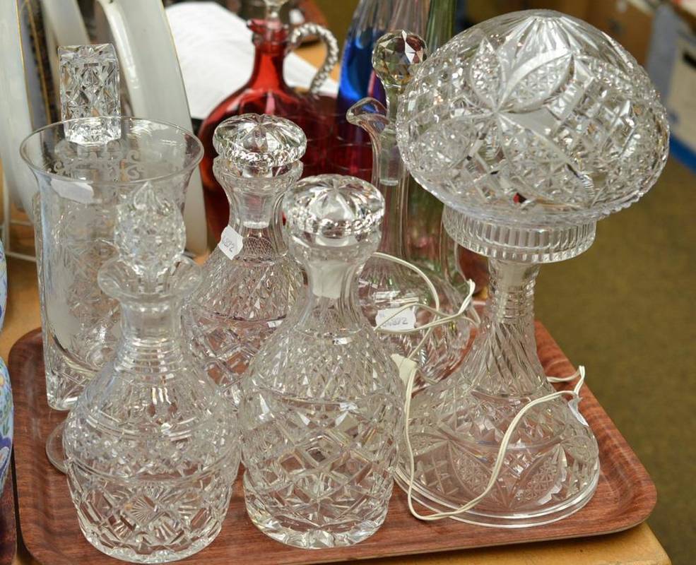 Lot 183 - Three crystal decanters, crystal claret jug, cut glass decanter, an engraved glass celery vase...