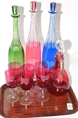 Lot 185 - A cranberry glass decanter, six cranberry wines and three coloured glass decanters