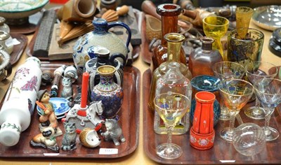 Lot 197 - Two trays including coloured glass, Goebel figures, rolling pin etc