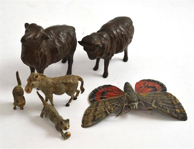 Lot 227 - A polychrome decorated butterfly, two small cold painted bronze cats, a donkey and two cast...