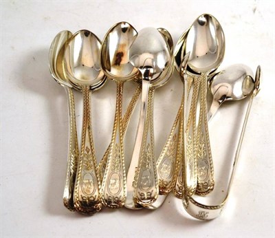 Lot 234 - A set of twelve silver bright cut teaspoons and matching tongs