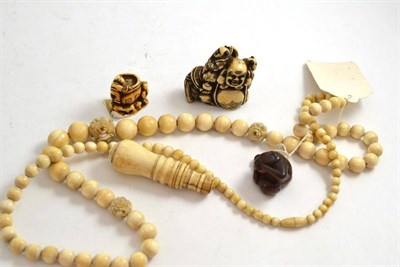 Lot 238 - Three early 20th century netsukes and a string of early 20th century ivory beads