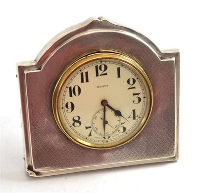 Lot 241 - A George V silver easel back bedroom timepiece