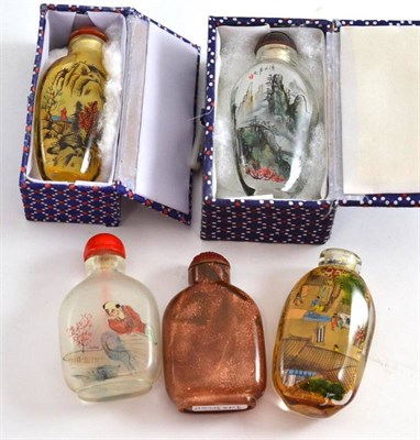 Lot 249 - Four assorted snuff bottles with internal decoration (two in boxes) and one other (5)