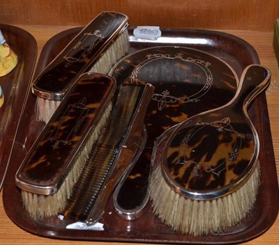 Lot 255 - A silver tortoiseshell five piece dressing table set with pique decoration, Birmingham 1922