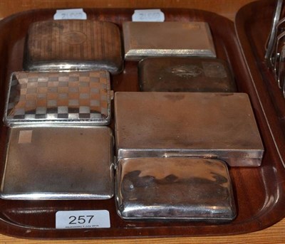 Lot 257 - Six assorted silver cigarette cases and another